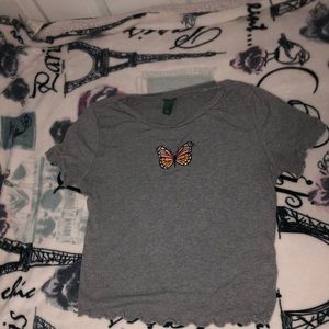 Gray crop top with a butterfly on it